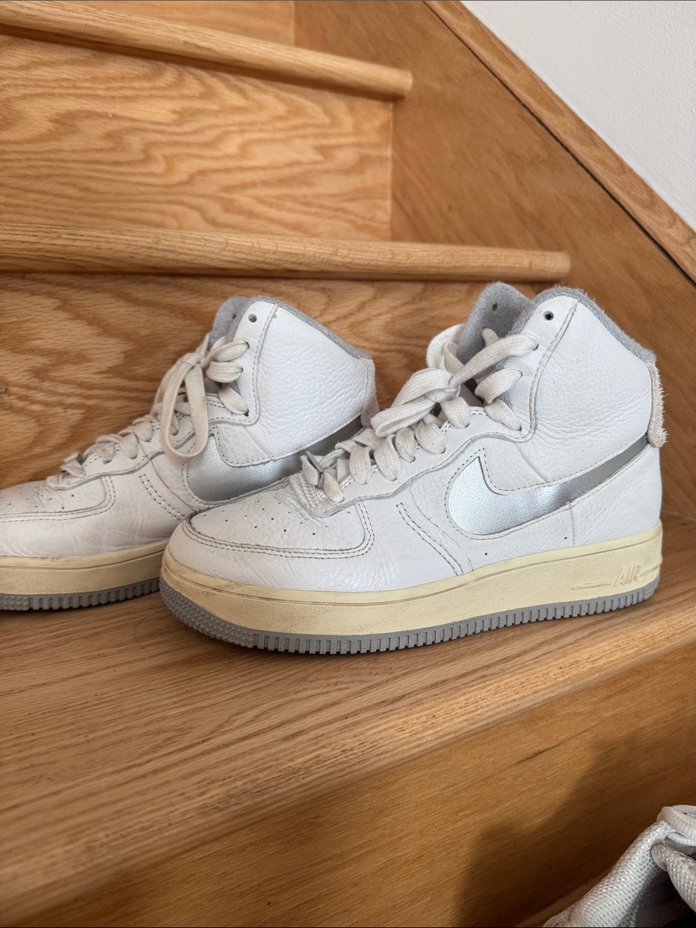 Nike Women’s White High-Top Sneakers with Silver Swoosh and Cream Midsole